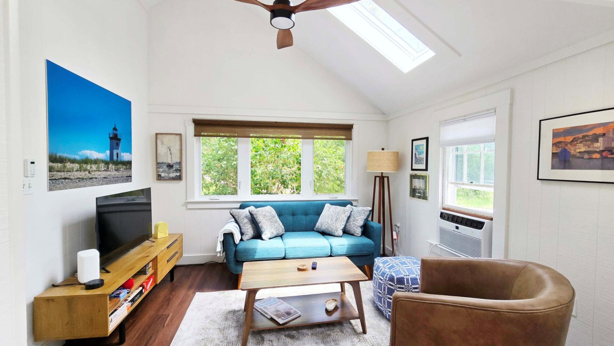 Living room with comfortable seating and large flat screen TV